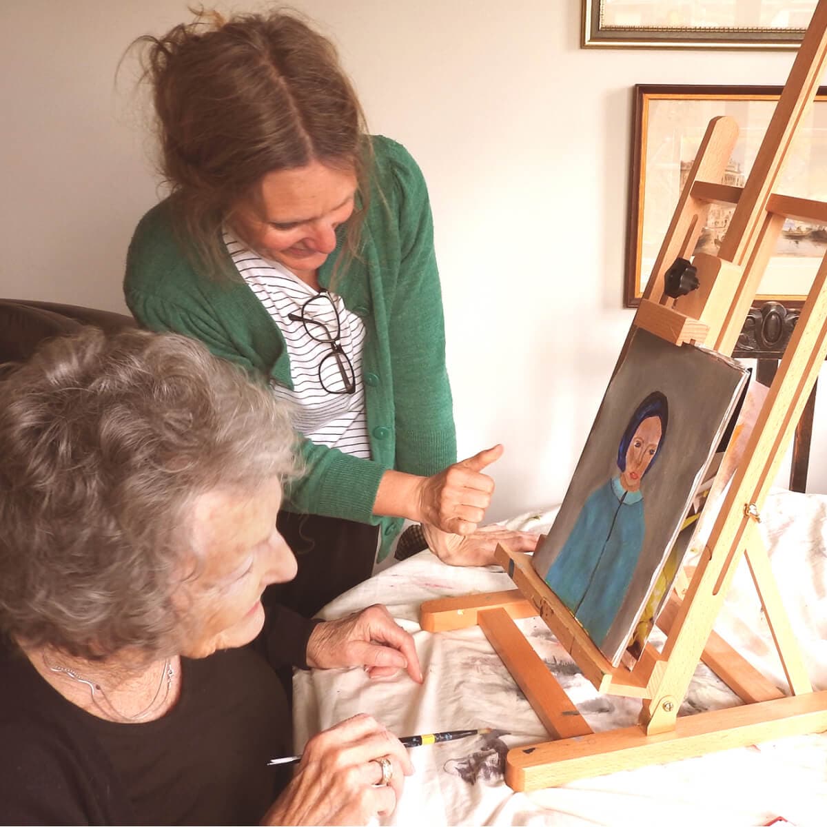 Elderly woman painting